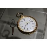 A GOLD CASED LADIES FOB WATCH STAMPED 14K, open faced, enamel dial, W 3.8 cm