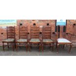 A SET OF FOUR OAK LADDERBACK DINING CHAIRS, together with another mahogany armchair (5)