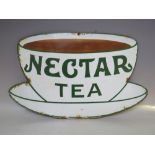A VINTAGE ENAMELLED SIGN FOR NECTAR TEA, single sided in the form of a tea cup and saucer, H 32