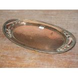AN ART NOUVEAU BELDRAY COPPER TRAY, of oval form with typical hammered and stylised embellishment, W