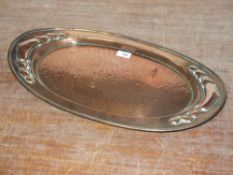 AN ART NOUVEAU BELDRAY COPPER TRAY, of oval form with typical hammered and stylised embellishment, W