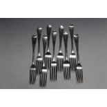 A MATCHED SET OF NINE HALLMARKED SILVER TABLE FORKS WITH CREST OF A BIRD PERCHED ON A BUGLE,
