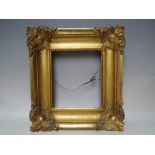 A GEORGIAN GOLD FRAME WITH CORNER EMBELLISHMENTS, frame W 7 cm, rebate 23 x 20 cm