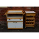 A MODERN BEECH KITCHEN TROLLEY WITH TILED TOP, together with a smaller similar trolley (2)