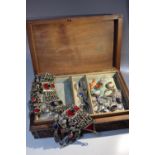 A CARVED WOODEN JEWELLERY BOX AND CONTENTS, to include a selection of vintage and modern costume
