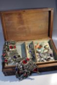 A CARVED WOODEN JEWELLERY BOX AND CONTENTS, to include a selection of vintage and modern costume