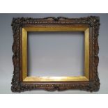 A LATE 18TH / EARLY 19TH CENTURY DECORATIVE SCUMBLED EFFECT SWEPT FRAME, with gold slip, frame W 6