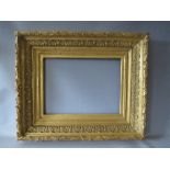 A 19TH CENTURY DECORATIVE GOLD FRAME, with acanthus leaf design and integral gold slip, frame W 13.5