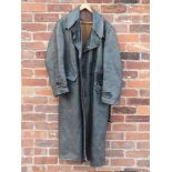 A GENTS VINTAGE MILITARY STYLE FULL LENGTH LEATHER COAT, complete with original belt, damage to