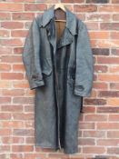 A GENTS VINTAGE MILITARY STYLE FULL LENGTH LEATHER COAT, complete with original belt, damage to
