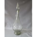 AN EARLY 20TH CENTURY LARGE GLASS APOTHECARY BOTTLE AND STOPPER, of baluster form, with spire