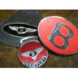 A SELECTION OF BENTLEY MOTORING RELATED ENAMEL BADGES ETC, to include a silver and enamel Bentley