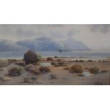 WARREN WILLIAMS (1860-1941). 'Penmaenmawr From Deganwy', a rocky shore scene with sailing vessels.