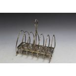 AN ORIENTAL WHITE METAL SIX DIVISION DRAGON TOAST RACK, carrying two stamps to side panel - see