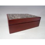 A VINTAGE WOODEN JEWELLERY BOX WITH HALLMARKED SILVER PANEL TO LID, the hinged lid opening to reveal