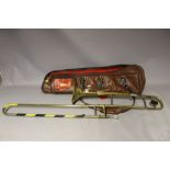 A VINTAGE BRASS TROMBONE BY BOOSEY & HAWKES A/F, in leather carry holdall, the holdall marked '
