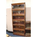 A VINTAGE MAHOGANY SIX STAGE GLOBE WERNICKE BOOKCASE, bearing labels, H 216 cm, W 86 ½ cm