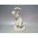 A COPELAND PARIAN WARE FIGURE OF A SCANTILY CLAD MAIDEN, seated on a rock, drinking from a shell,