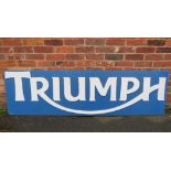 A LARGE TRIUMPH MOTORCYCLE DEALERSHIP SIGN, mounted on a wooden board, W 22 cm, H 60 cmCondition