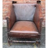 A VINTAGE STUDDED LEATHER TUB CHAIR, with turned foot rail, W 70 cm, D 73 cm, H 69 cm