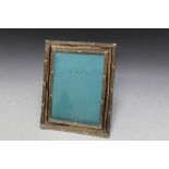 A HALLMARKED SILVER EASEL BACK PHOTO FRAME - BIRMINGHAM 1907. H 26.75 cm