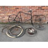 A VINTAGE BICYCLE FRAME, together with a selection of wheels, tyres and pedals