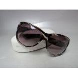 A PAIR OF YVES SAINT LAURENT TORTOISESHELL / BROWN OVERSIZE SUNGLASSES, complete with rigid case and