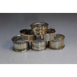 A COLLECTION OF SIX ASSORTED HALLMARKED SILVER NAPKIN RINGS, various dates, makers and styles,