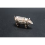 A NOVELTY WHITE METAL VESTA CASE IN THE FORM OF A PIG, W 5 cm
