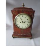 A NINETEENTH CENTURY REGENCY MAHOGANY MANTEL CLOCK, of classical outline, the mahogany casing