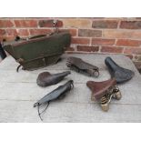 A SELECTION OF VINTAGE BICYCLE SADDLES, together with a WWII army bicycle leather frame bag