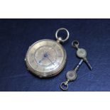 A HALLMARKED 18 CARAT GOLD OPEN FACED MANUAL WIND POCKET WATCH, with two keys, Dia 4 cm