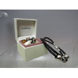 A PANDORA LEATHER CHARM BRACELET AND CHARMS, charms comprised of three heart themed charms, approx L