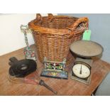 A LARGE VINTAGE WICKER LOG BASKET, together with a Victorian painted boot scraper, vintage bellows