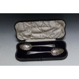 A CASED MATCHED PAIR OF HALLMARKED SILVER BERRY SPOONS LONDON, one by makers mark IB - London