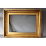 A 19TH CENTURY GOLD FRAME, with egg and dart design to outer edge and gold slip, frame W 10 cm, slip