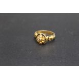 A VICTORIAN 18 CARAT GOLD MOURNING RING, with central diamond chip detail, seed pearls (three
