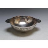 A HALLMARKED SILVER TWIN HANDLED BOWL - BIRMINGHAM 2011, similar to a large quaich, with hand