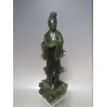 A CARVED HARDSTONE SCULPTURE OF AN ORIENTAL FIGURE IN ROBES, H 23.5 cm