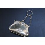 A HALLMARKED SILVER FINGER PURSE BY ROBERT PRINGLE & SON - BIRMINGHAM 1910, with tan leather