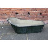 A VINTAGE TIN BATH, with carry handle to one end and pouring spout to the other, L 170 cm