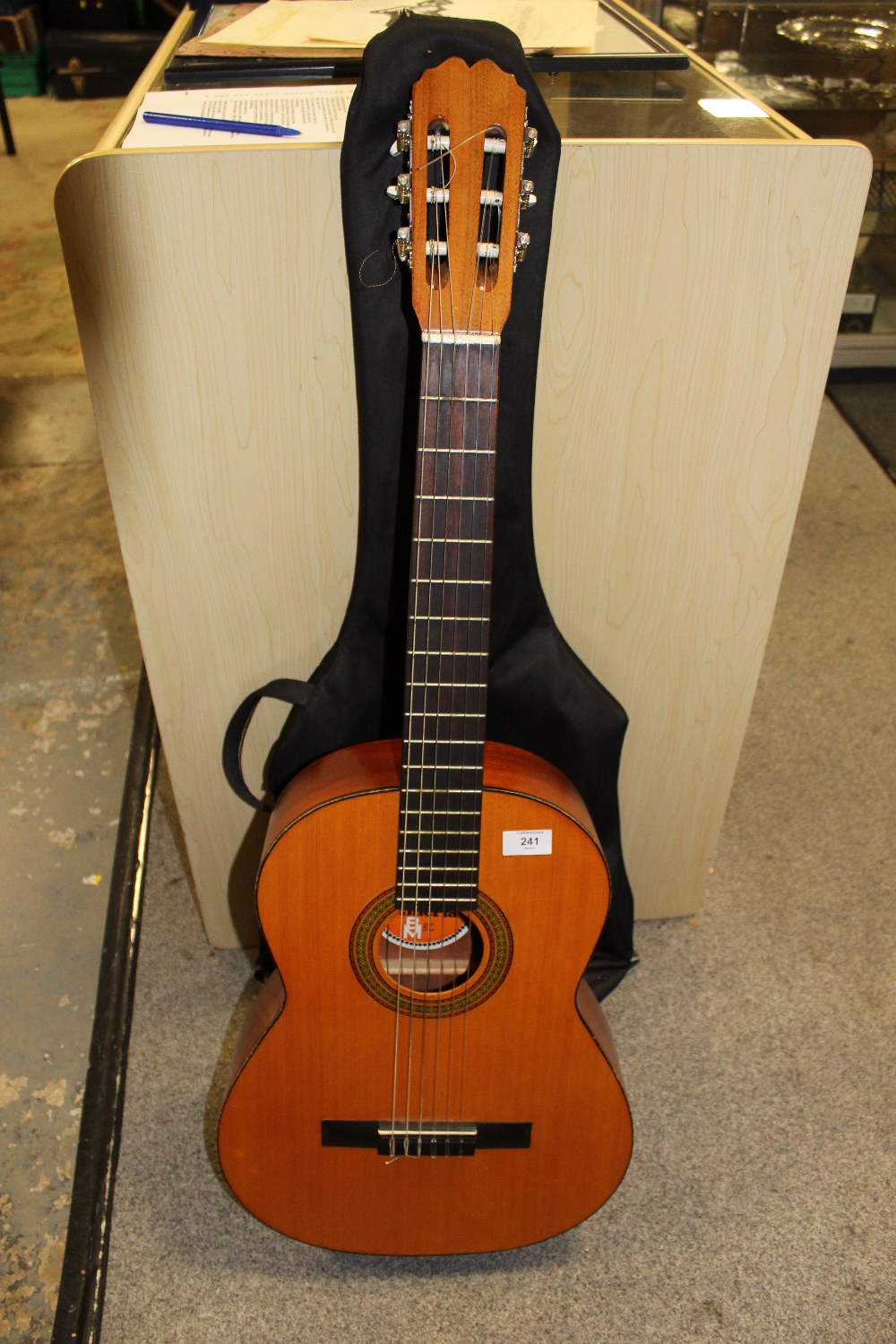 AN ALMERIA ACOUSTIC GUITAR WITH TRAVEL BAG