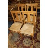 A SET OF FOUR WICKER SEAT SCHOOL STYLE CHAIRS