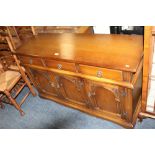 A REPRODUCTION OAK CARVED SIDEBOARD W-137 CM