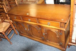 A REPRODUCTION OAK CARVED SIDEBOARD W-137 CM