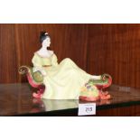 A ROYAL DOULTON FIGURINE 'AT EASE' HN2472