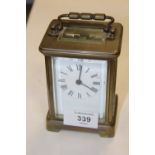 A VINTAGE BRASS CARRIAGE CLOCK