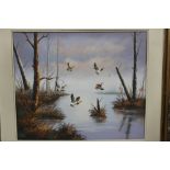 A GILT FRAMED OIL ON BOARD OF DUCKS IN FLIGHT OVER A RIVER, SIGNED BOND LOWER RIGHT, OVERALL