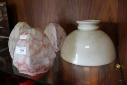 A QUANTITY OF VINTAGE RETRO GLASS SHADES TOGETHER WITH AN OIL LAMP