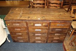 A VINTAGE BANK OF THREE DRAWERS WITH A LATER PLANK TOP H-76 CM W-149 CM